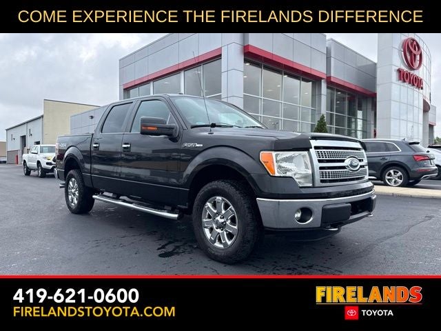 2014 Ford F-150 XLT in Tuxedo Black Metallic — front three-quarter view