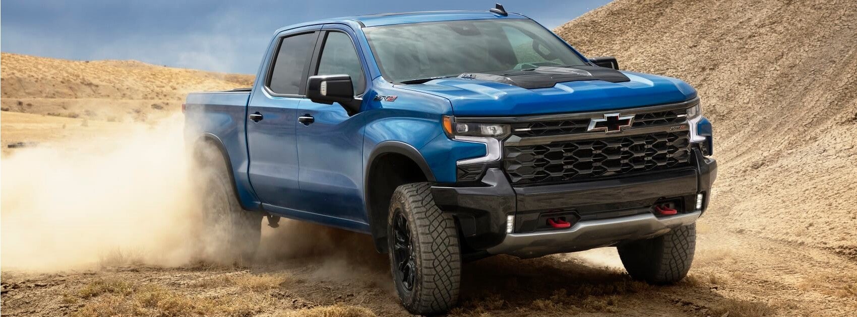 2022 Chevy Silverado in Blue on Dirt Snipped