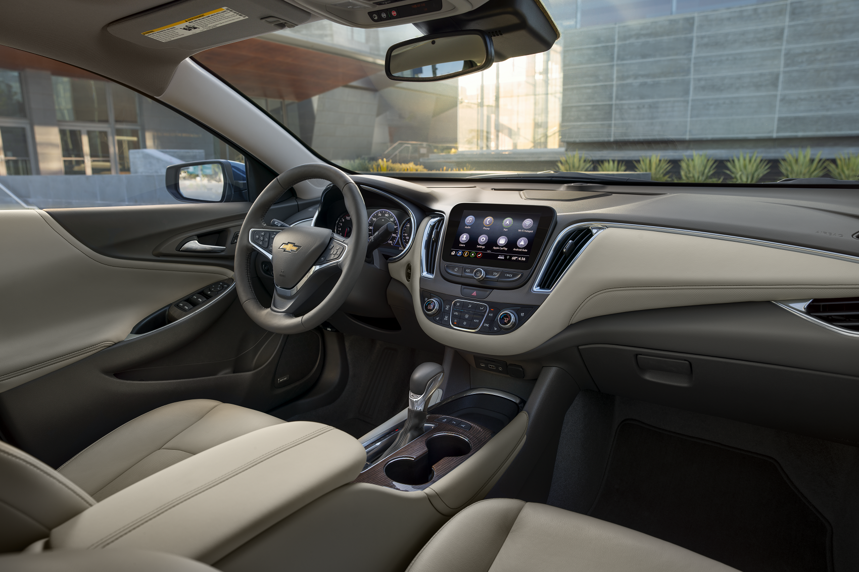 spacious chevy malibu interior includes beige leather and touchscreen dashboard technology